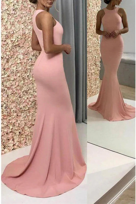 Teen wearing an elegant strapless mermaid trumpet prom dress.