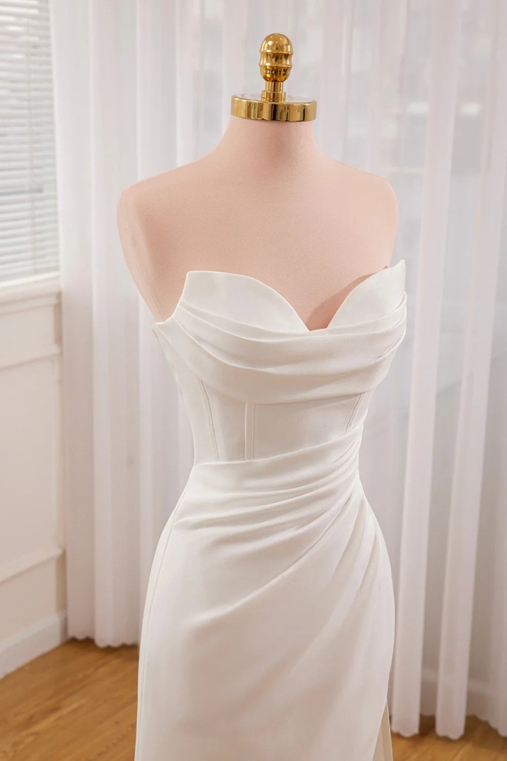Mermaid satin wedding dress with detachable skirt.