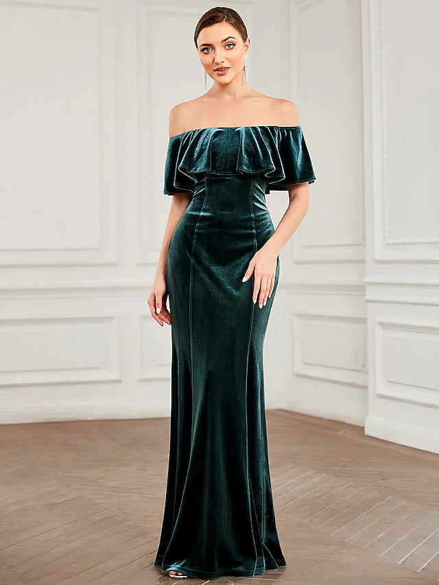Side profile of a strapless velvet mermaid trumpet dress for bridesmaids.