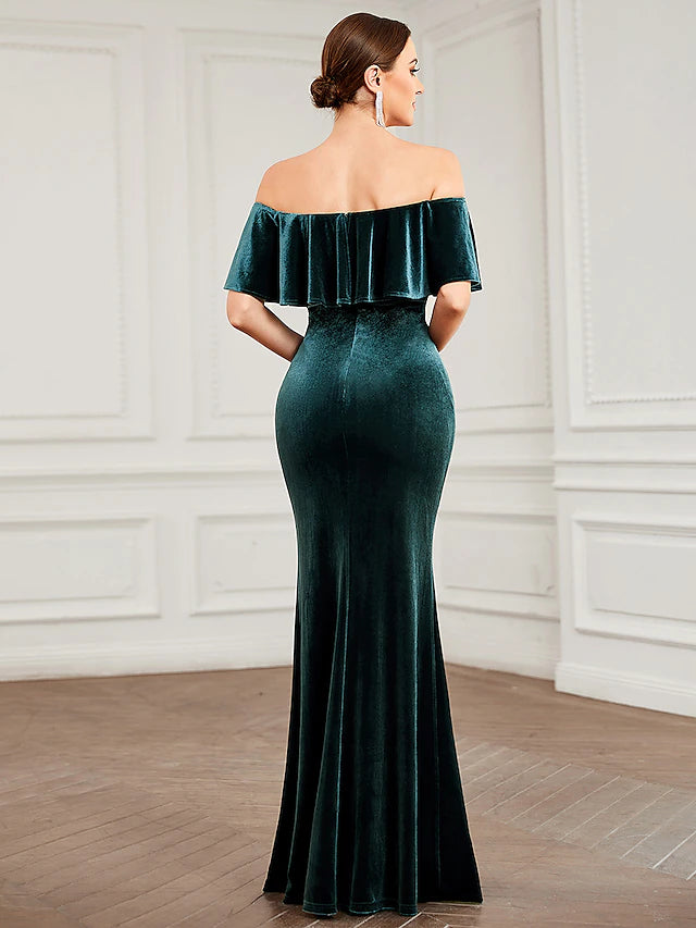 Close-up of the velvet fabric and pleated detail on a bridesmaid gown.