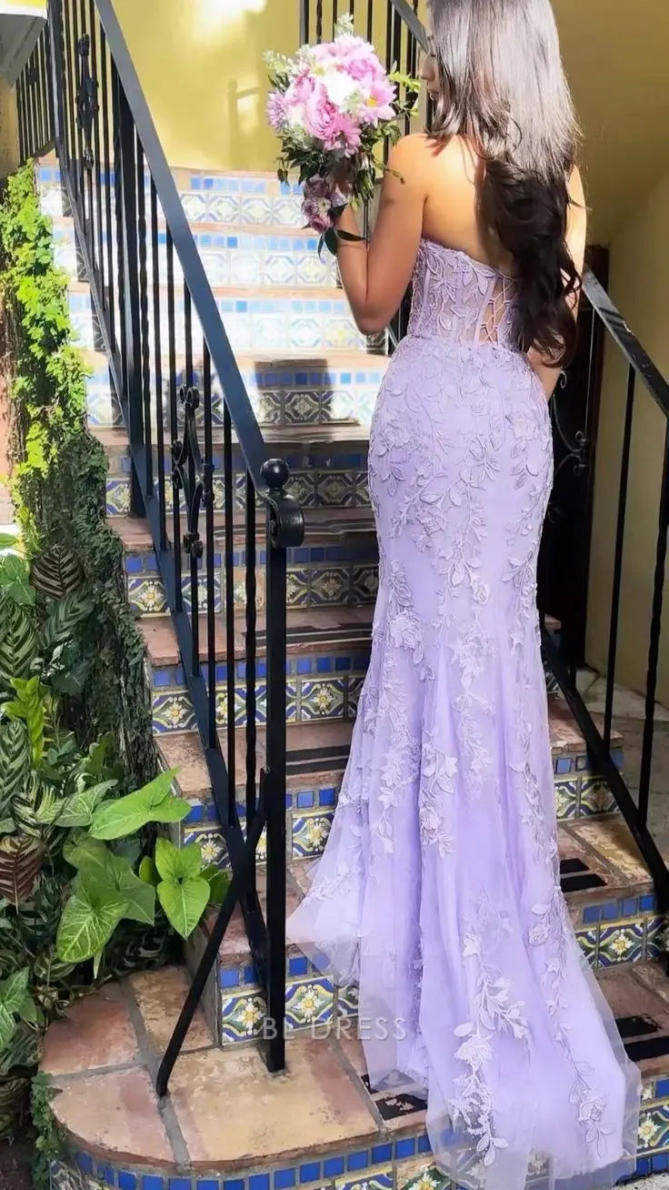 Back view of a purple mermaid strapless evening gown.