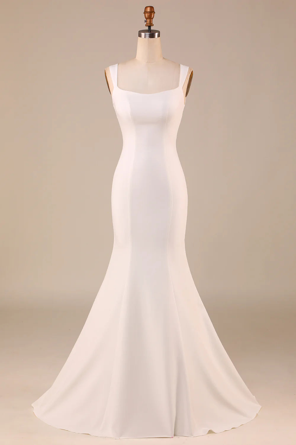 Front view of an elegant ivory strapless mermaid wedding gown with a sweep train and bowknot.