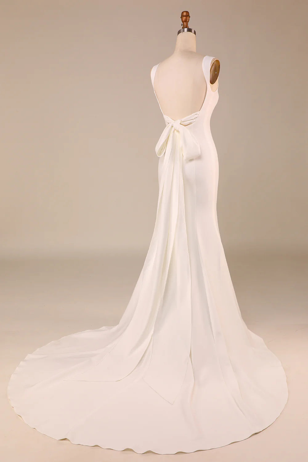 Back view of the ivory mermaid wedding dress, highlighting the sweep train and delicate bowknot detail.