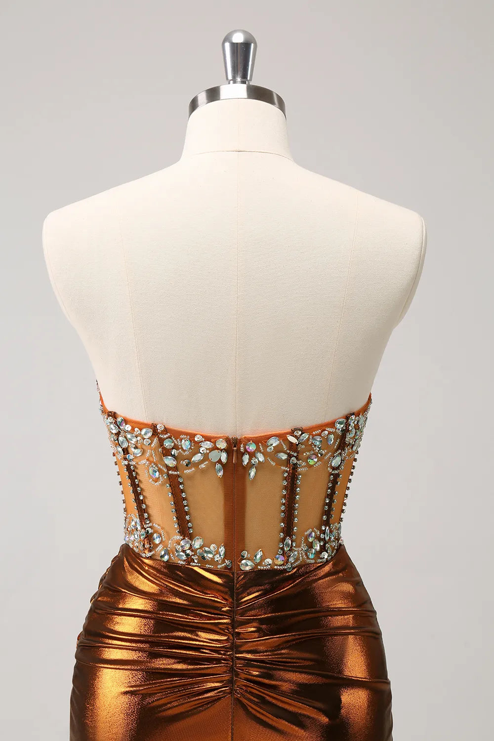 Close-up of the intricate beading on the copper homecoming dress.