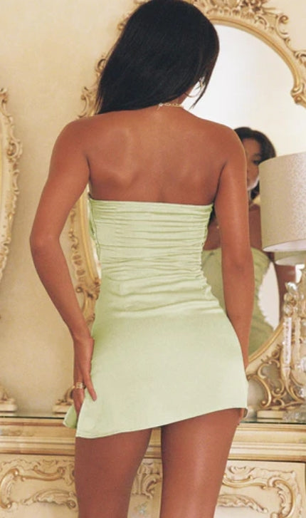 Model showcasing a mini strapless party dress.