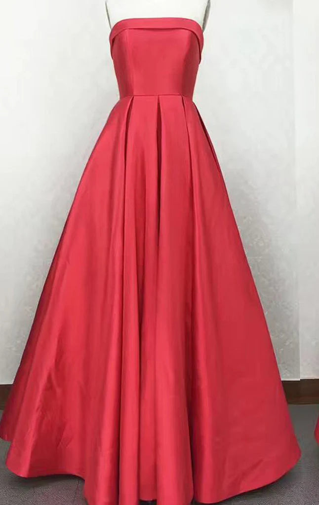 Side view of a woman showcasing a strapless satin evening gown.