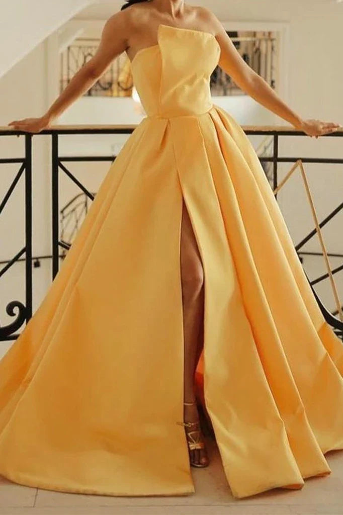 Full length view of a model posing in a strapless satin formal gown.