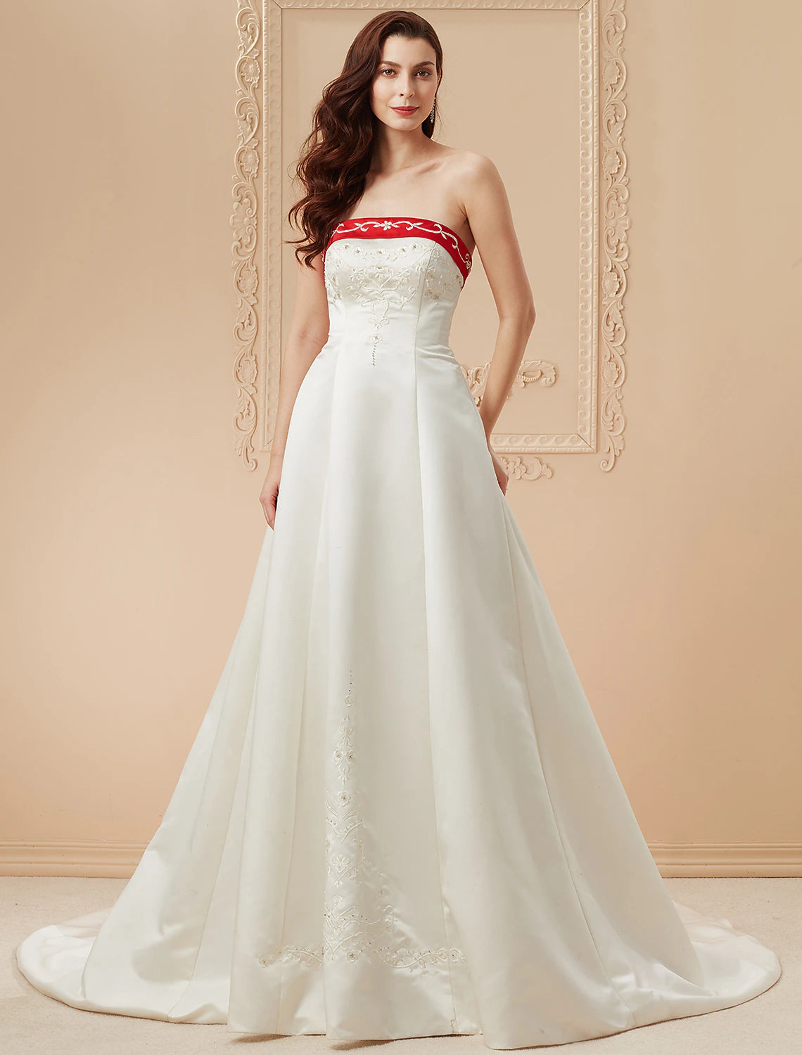 Elegant strapless satin ball gown wedding dress with open back and embroidery appliques.