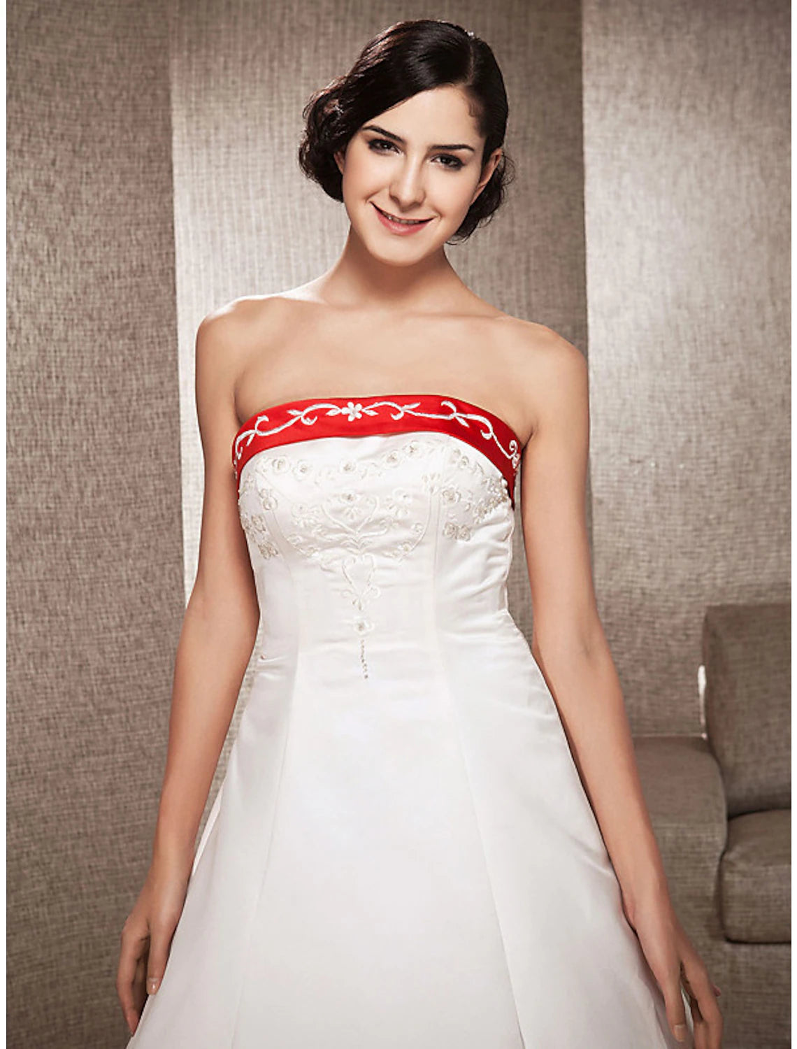 Back view of the strapless satin wedding dress, showcasing the open back design.