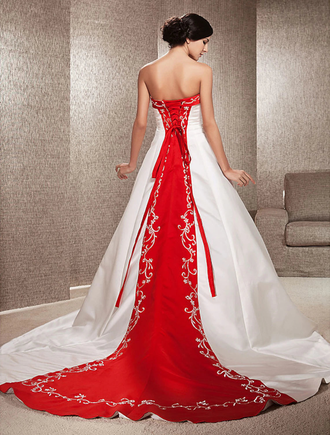 Another angle of the strapless satin wedding dress, highlighting the train.