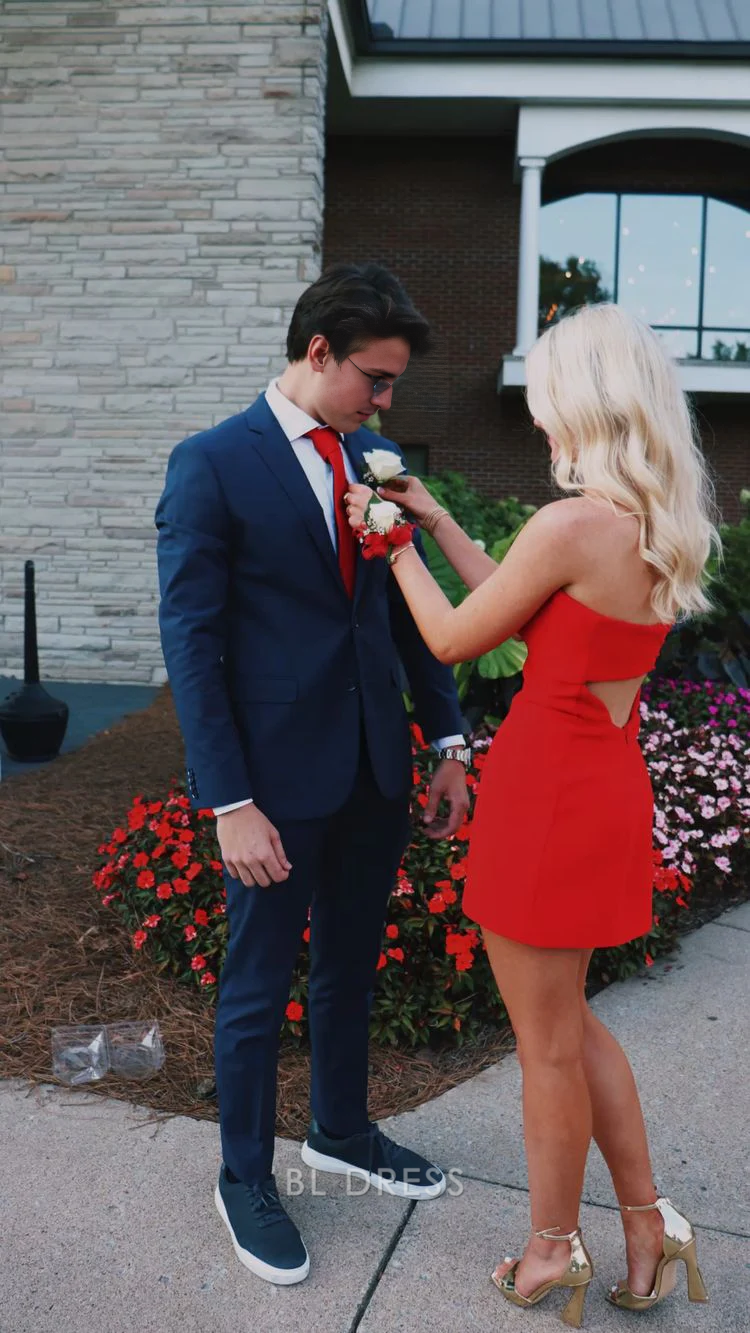 Side view of a woman wearing a red strapless bodycon mini dress.