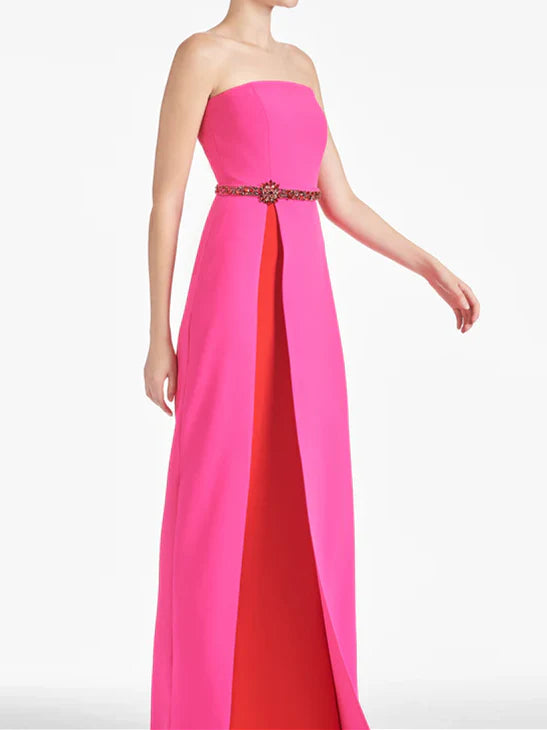 Back view of a formal strapless sheath gown for a wedding.