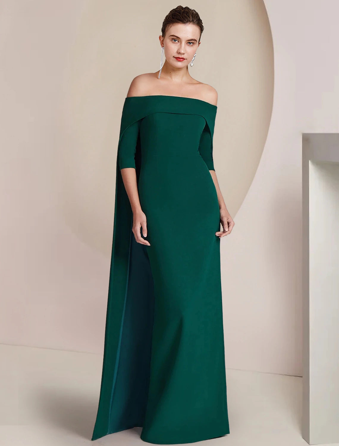 Woman wearing an elegant strapless sheath floor-length formal dress.