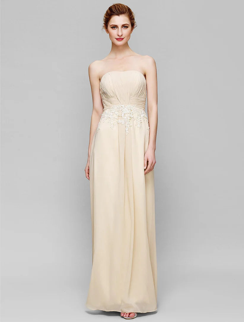 Close-up of the chiffon lace fabric and ruched details on the strapless Mother of the Bride dress.