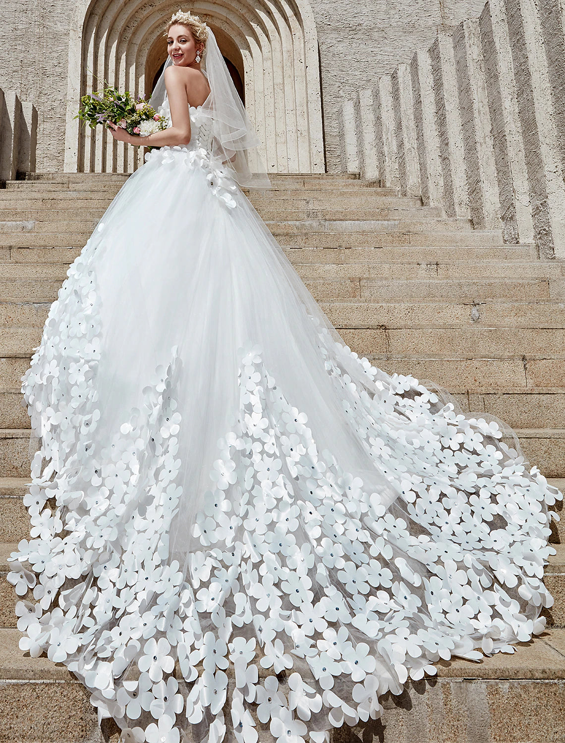 Elegant strapless square neck ball gown wedding dress with lace and chapel train.