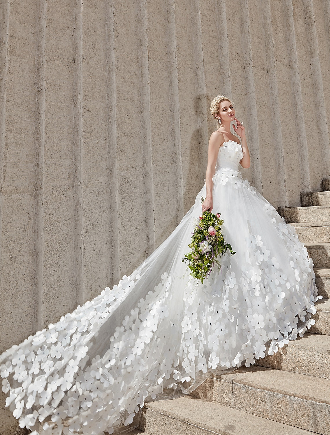 Detail of the square neckline and bodice of an elegant bridal gown.