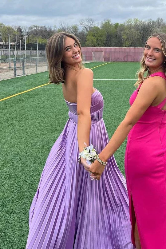 Model posing in the elegant strapless A-line prom dress.