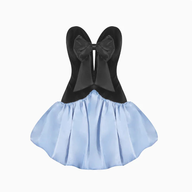 Detail of the large black satin bow on the light blue puffy skirt.