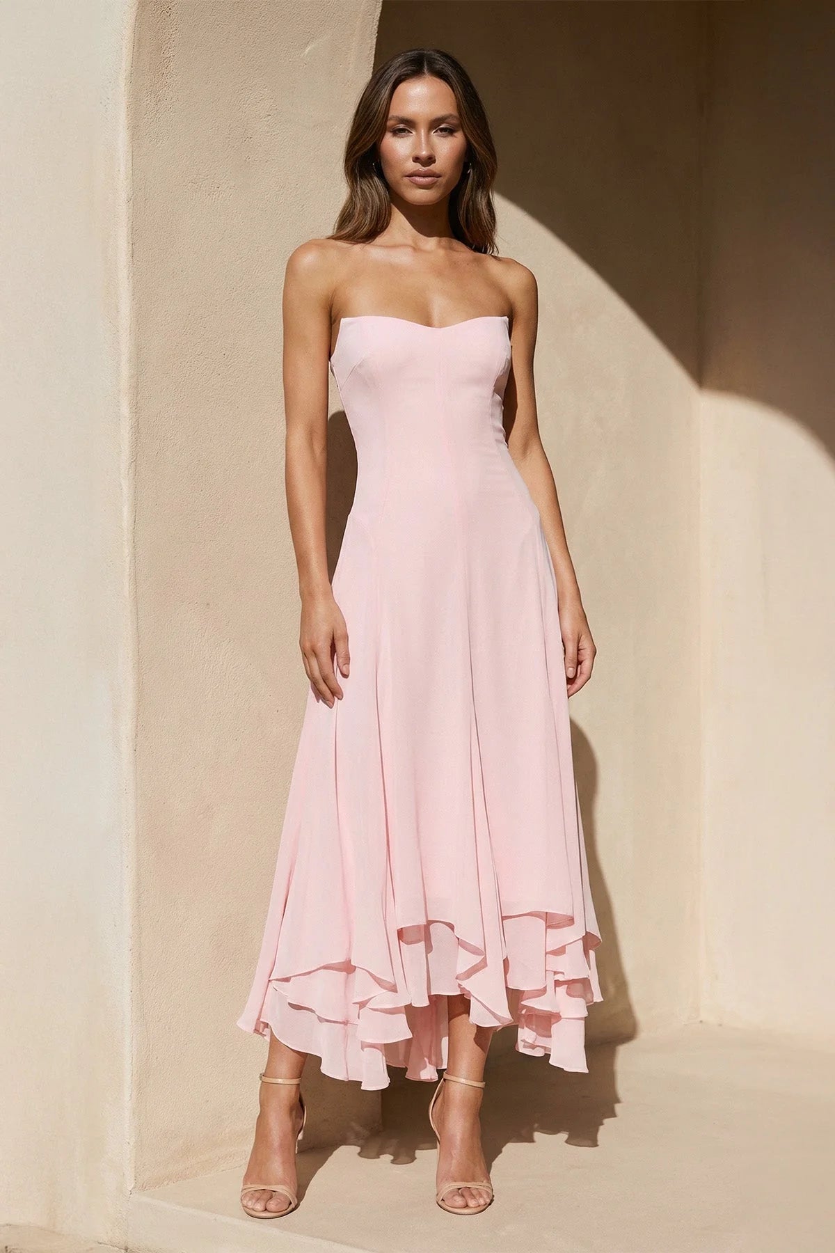 Full view of the elegant strapless sweetheart chiffon high-low dress.