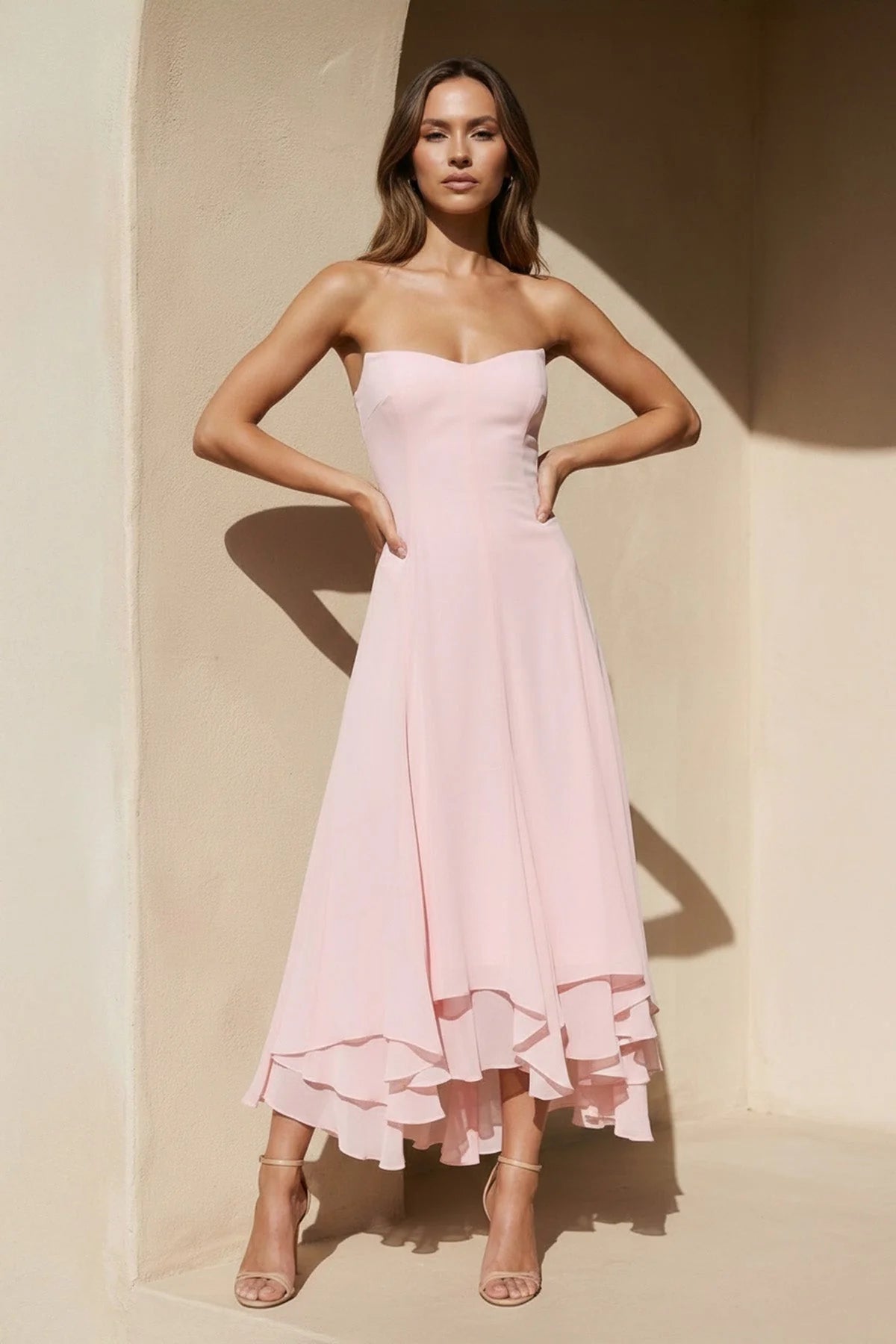Side view of the layered chiffon high-low prom dress.