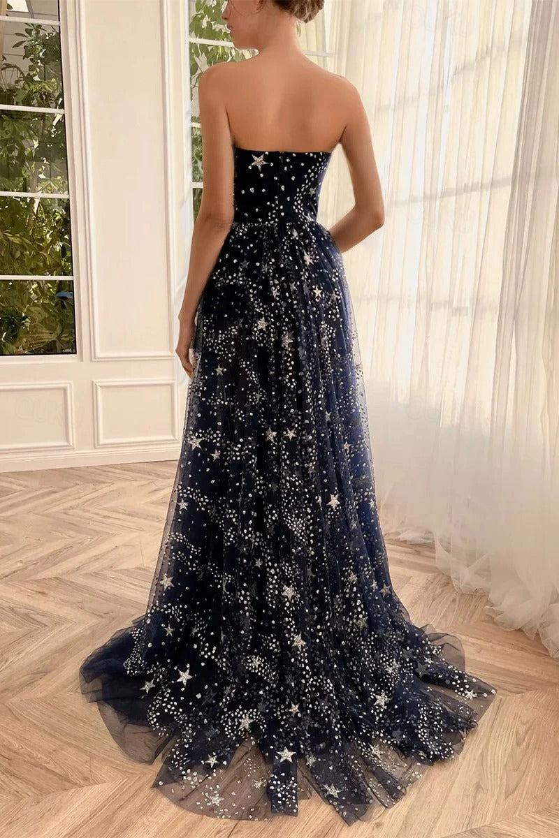 Side view of the high slit on a strapless sweetheart prom dress.