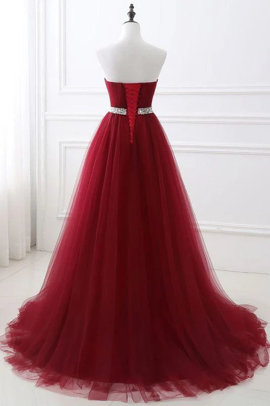 Back view of strapless sweetheart tulle prom dress with lace-up detail.