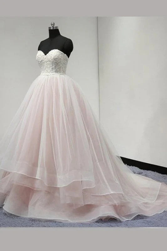Elegant strapless sweetheart ball gown wedding dress.