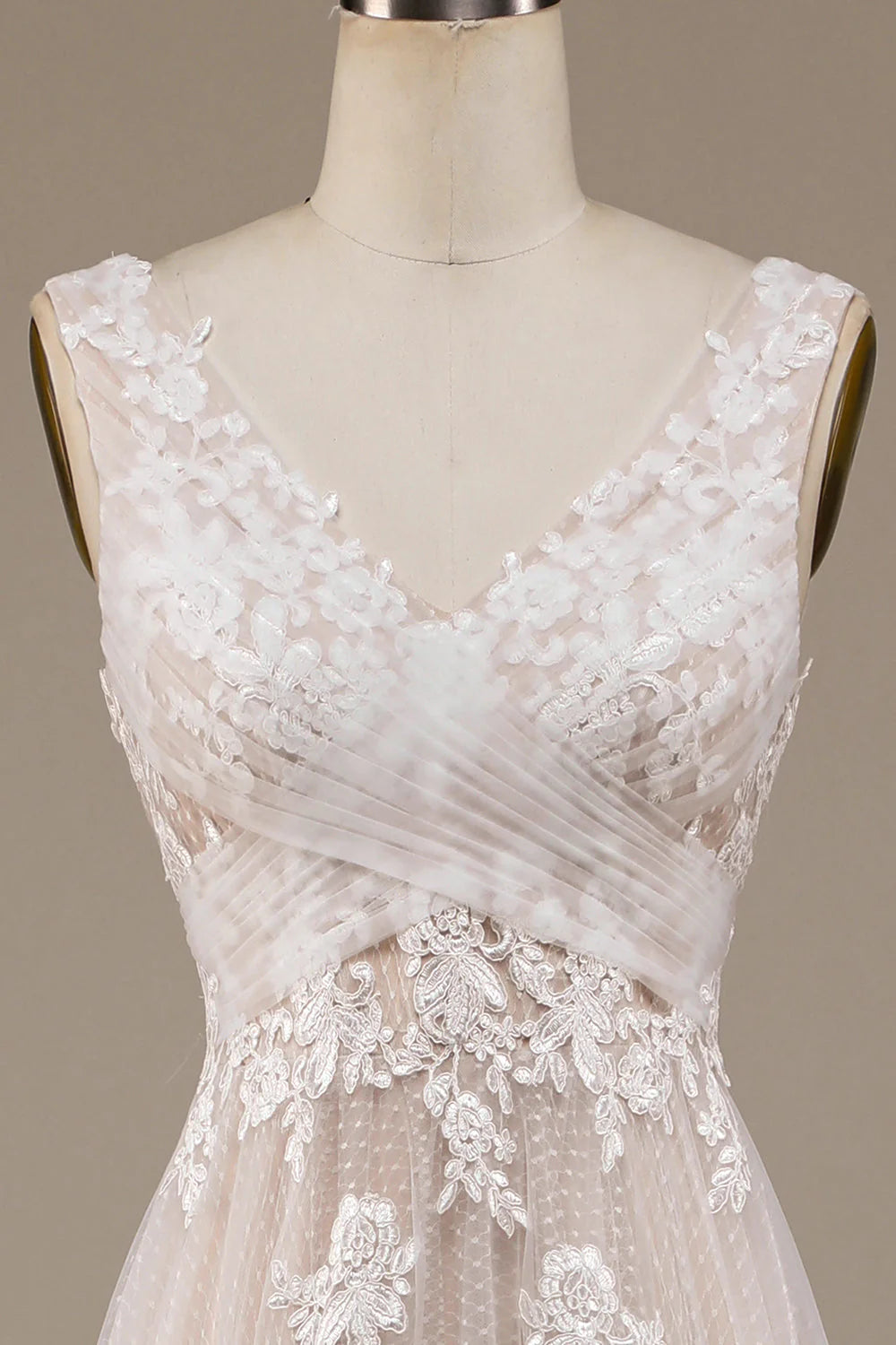 Back view of a wedding dress, highlighting the sweep train and lace embellishments.