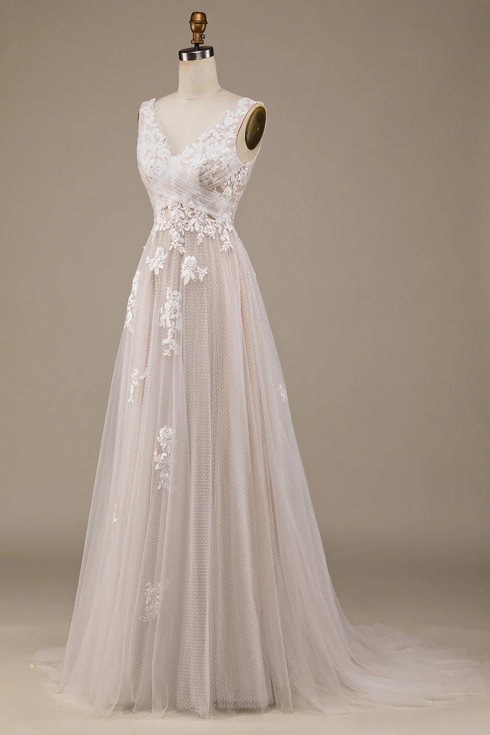 Close-up of the lace and tulle fabric on a strapless wedding dress.