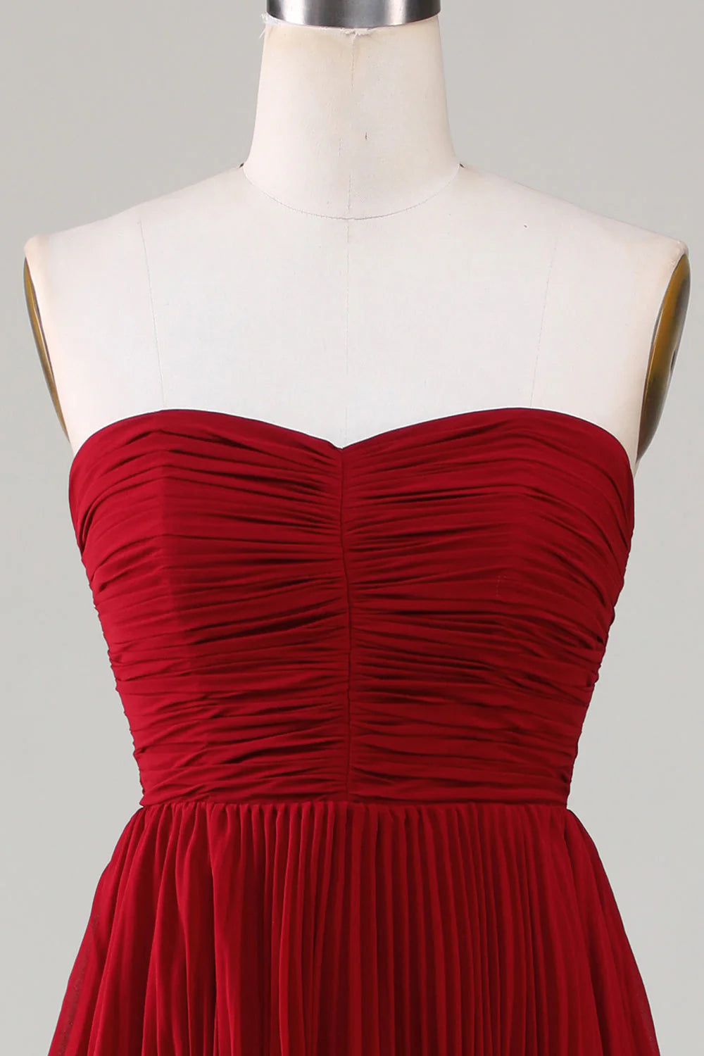Detail of the tiered skirt on the long bridesmaid dress.