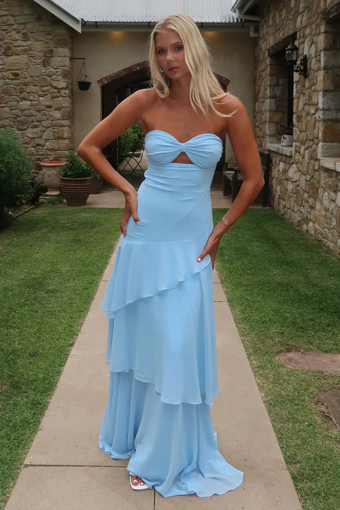 Side profile of the sky blue tiered ruffle maxi dress.