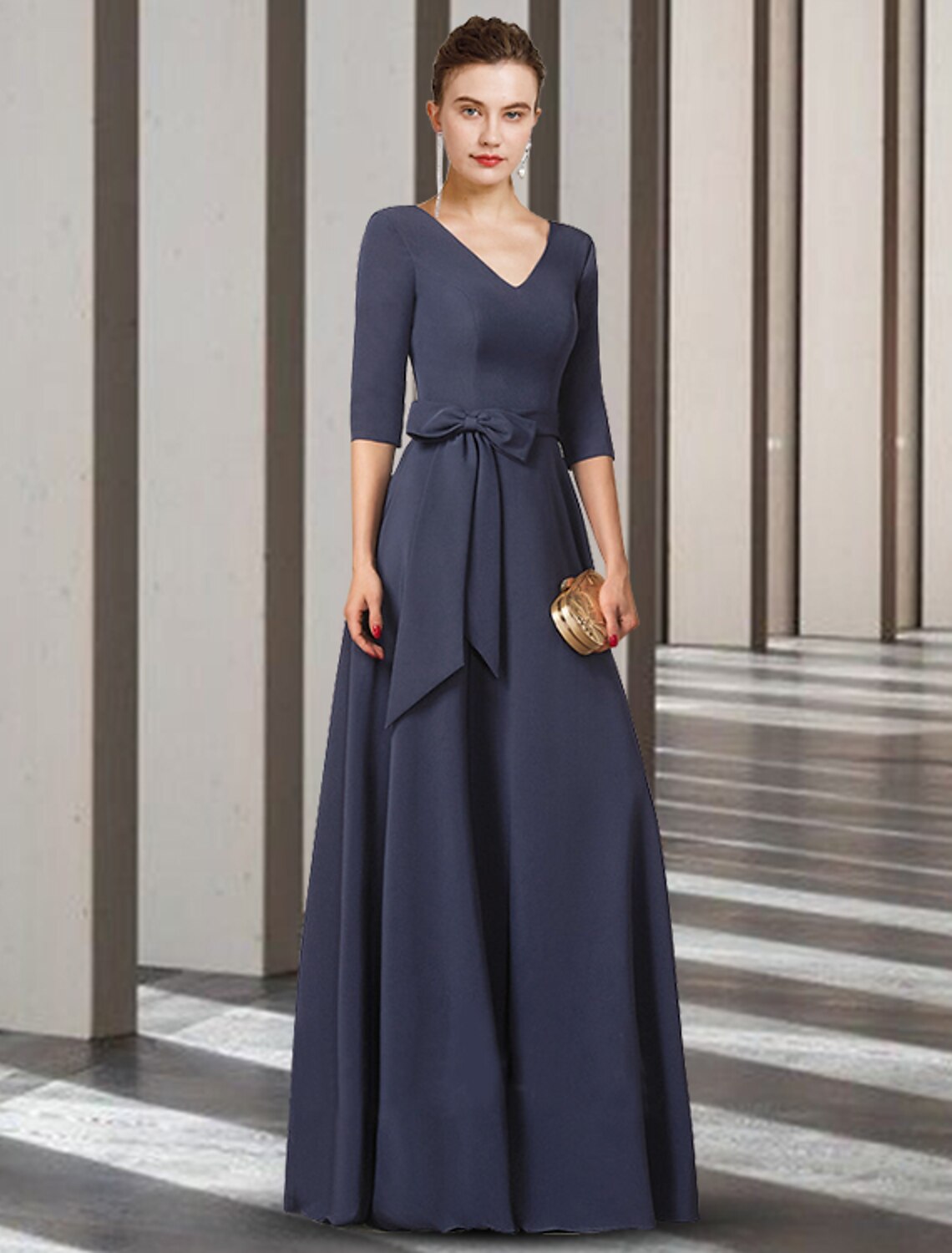 Side view of elegant stretch chiffon Mother of the Bride dress, showing pleats and drape.