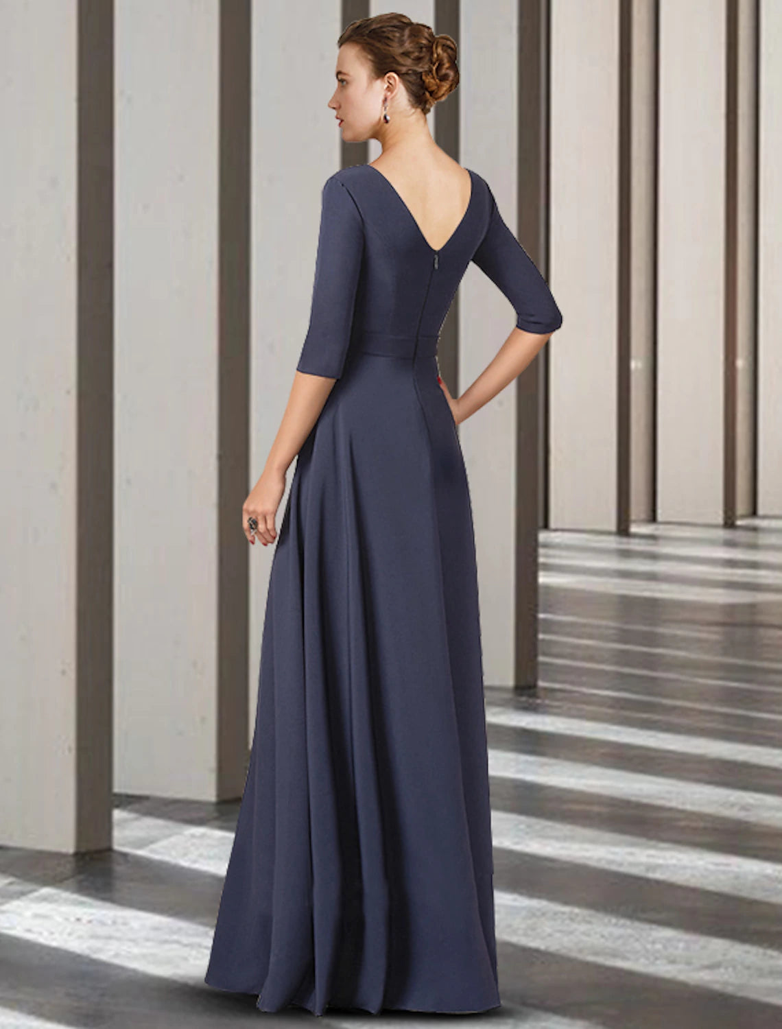 Back view of floor-length sheath dress, highlighting the sophisticated silhouette.