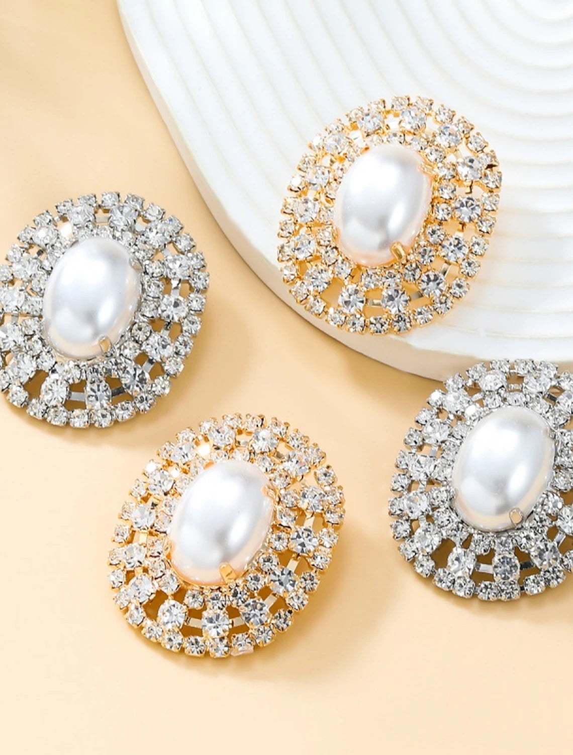 Elegant silver and gold stud earrings.