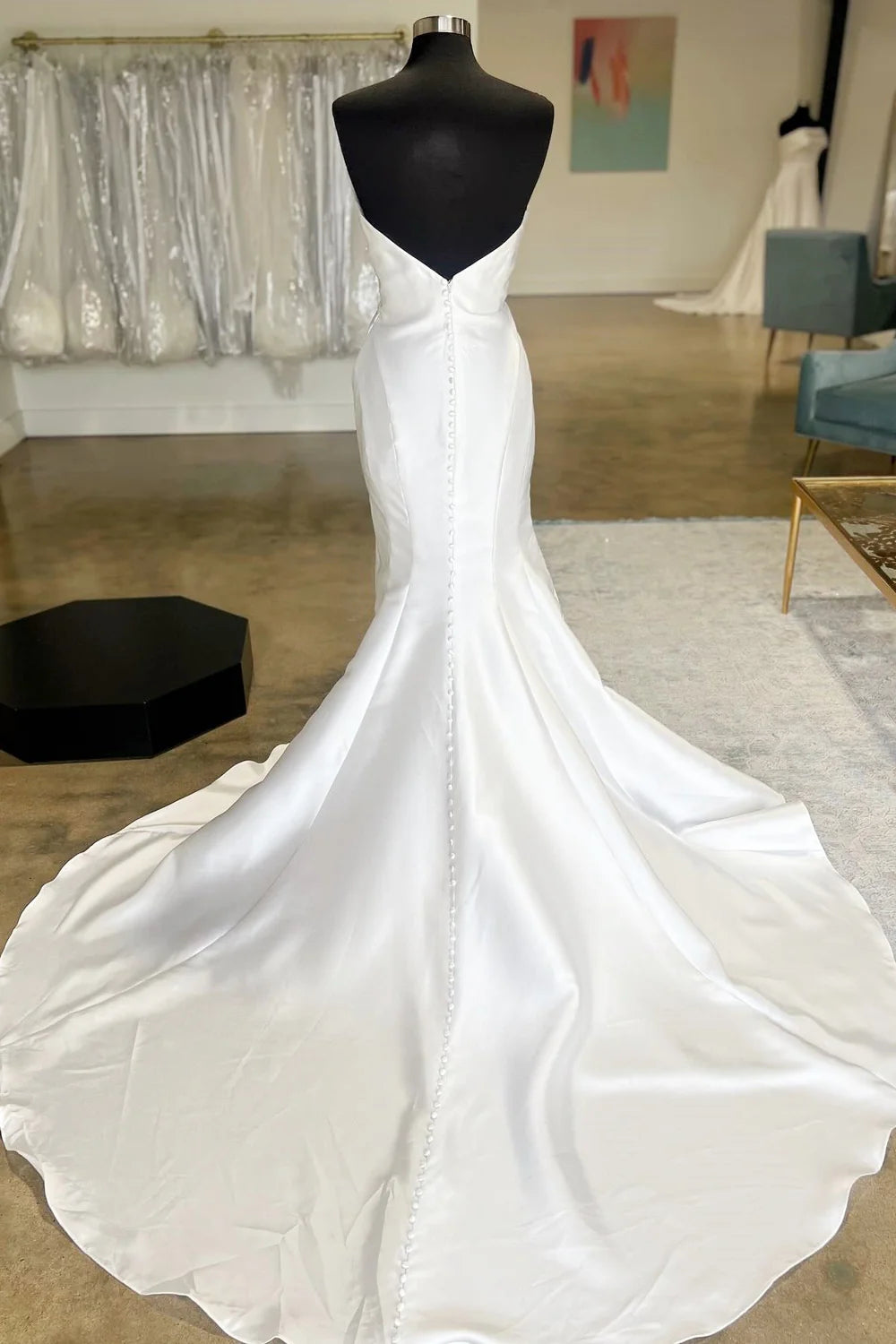 Side view of a long formal bridal gown.