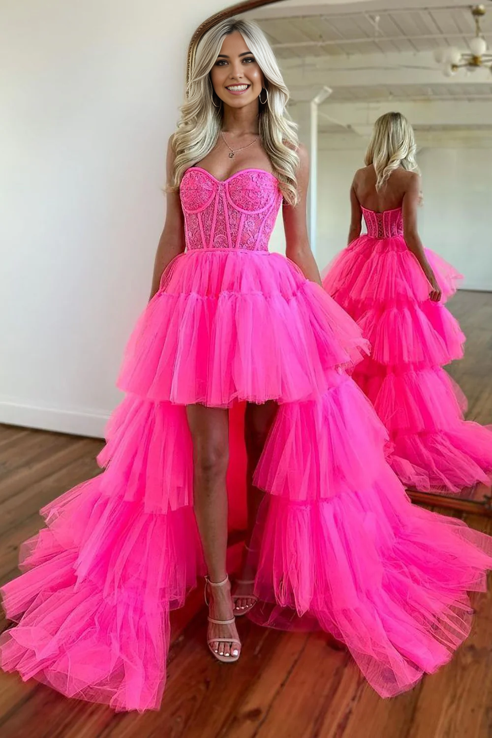Hot pink high-low tulle prom dress with sweetheart neckline.