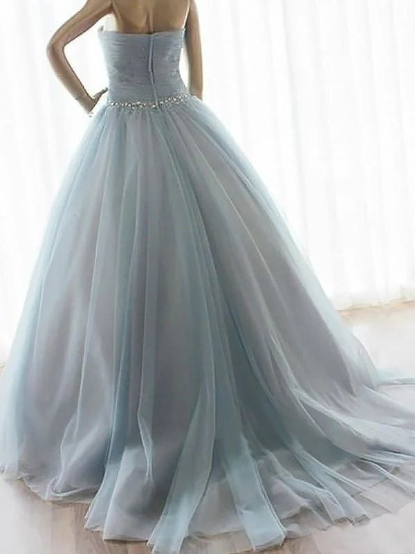Close-up of beading on a sweetheart tulle prom dress.