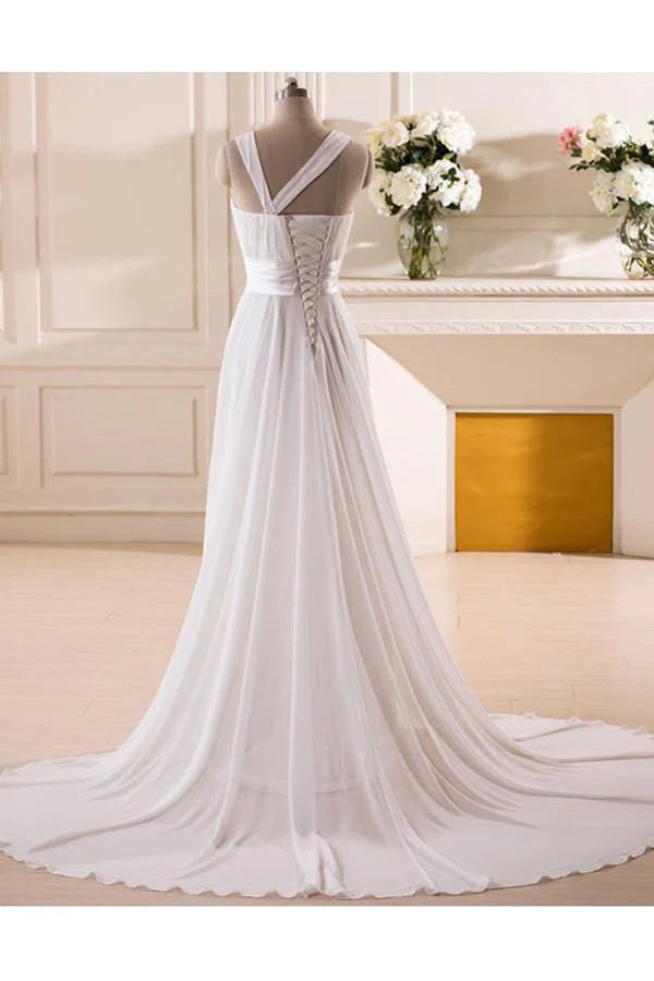 Side view of a sweetheart chiffon wedding dress, showcasing handmade flower embellishments.