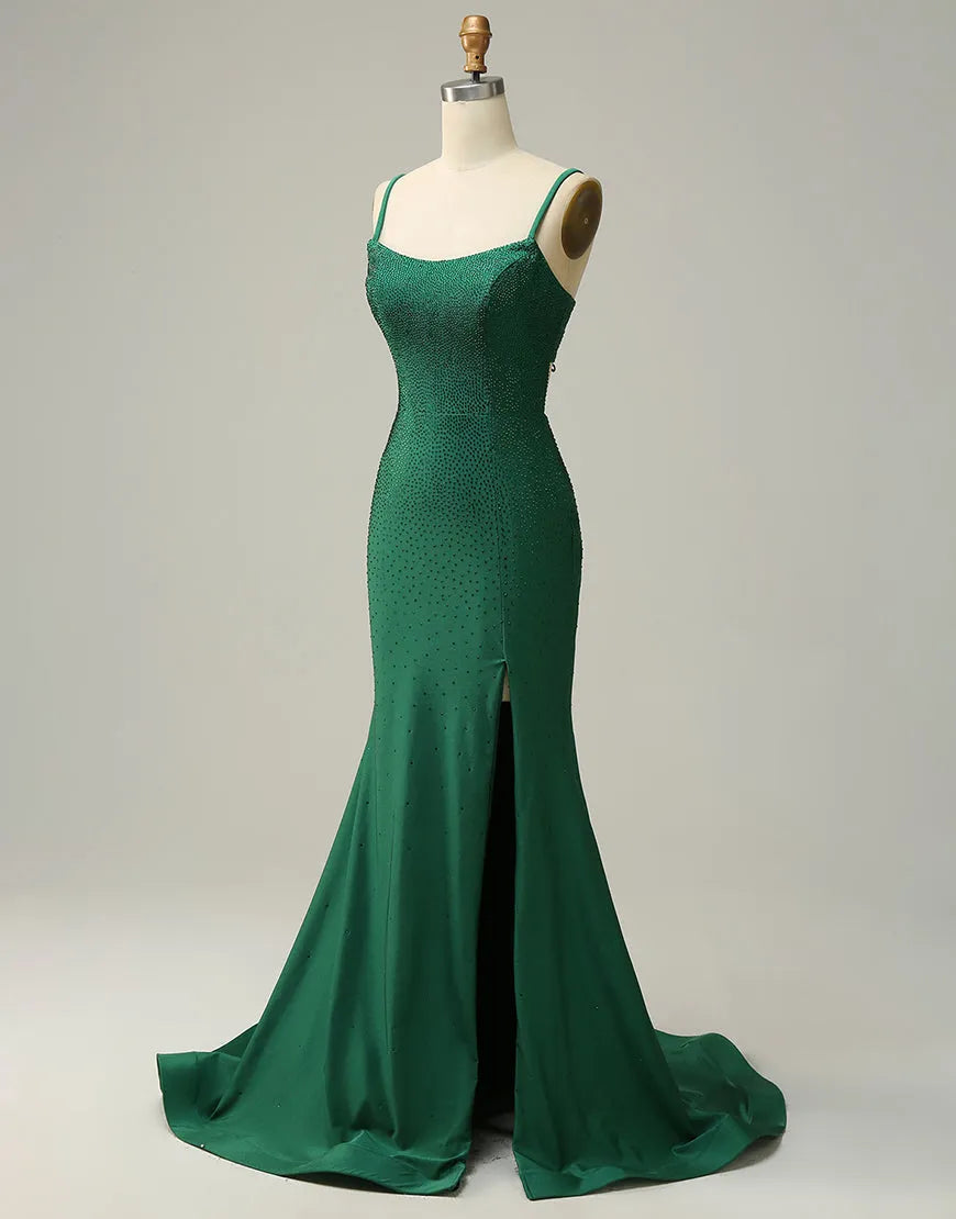 Side view of dark green prom dress highlighting the high slit.