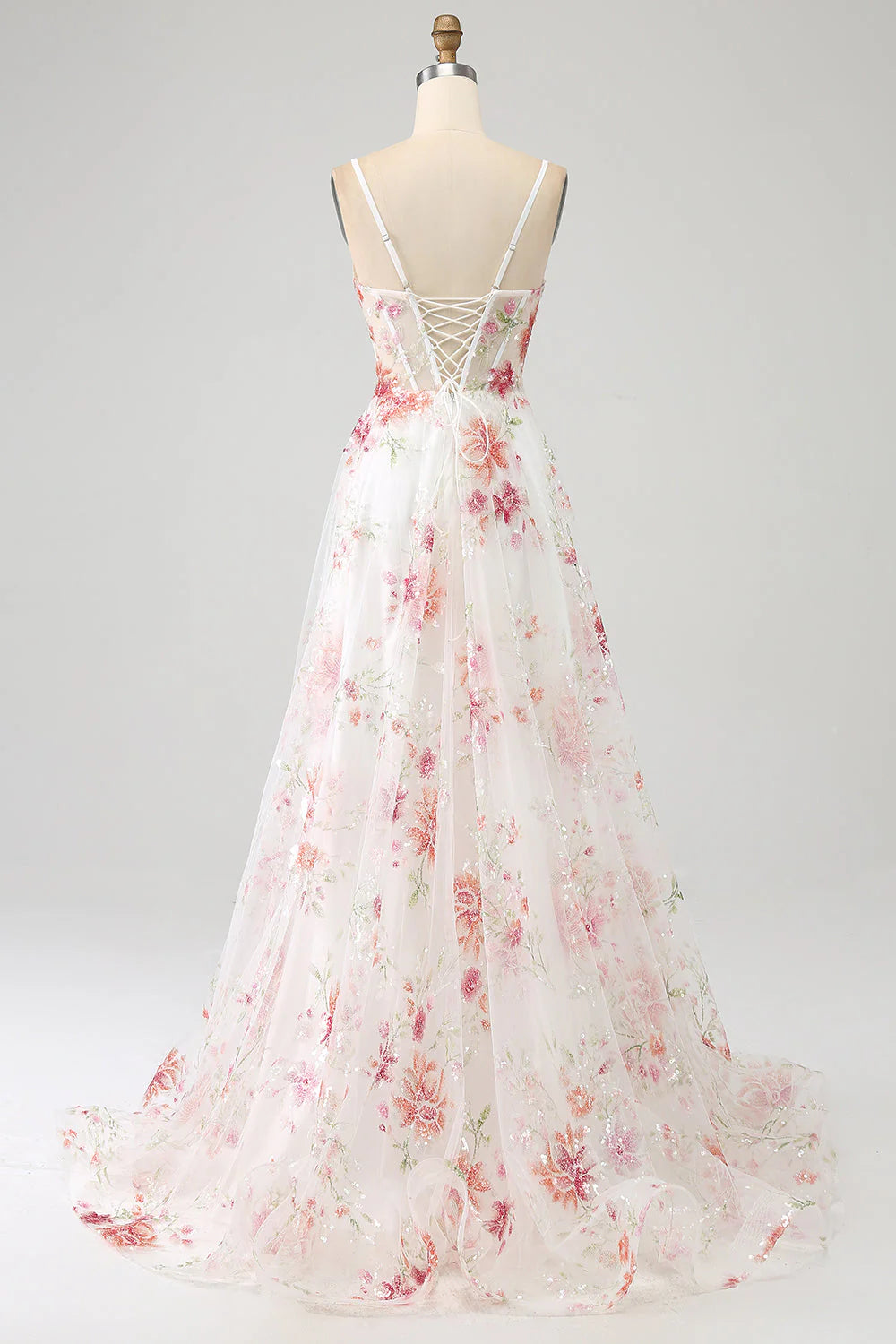 Back view of the ivory floral embroidered long prom dress, showcasing the corset detail.