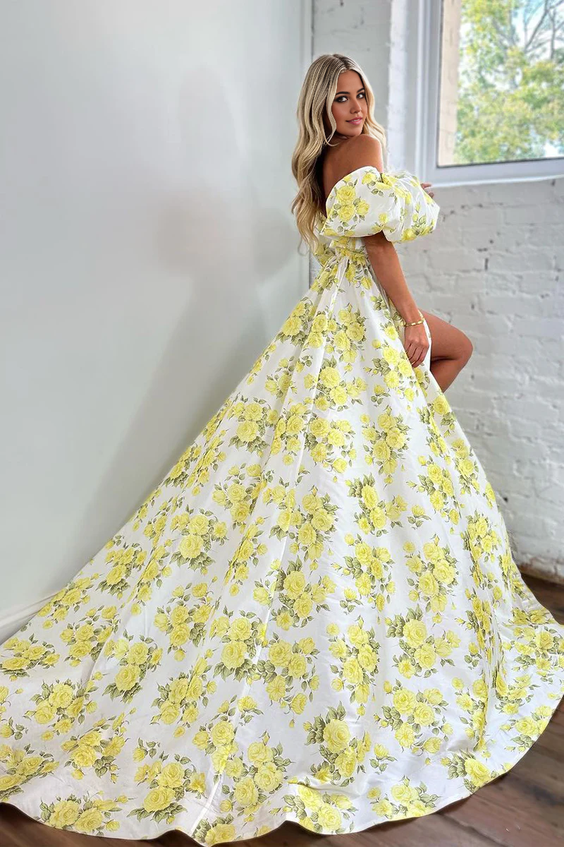 Side view of long floral satin ball gown with sweetheart neckline.
