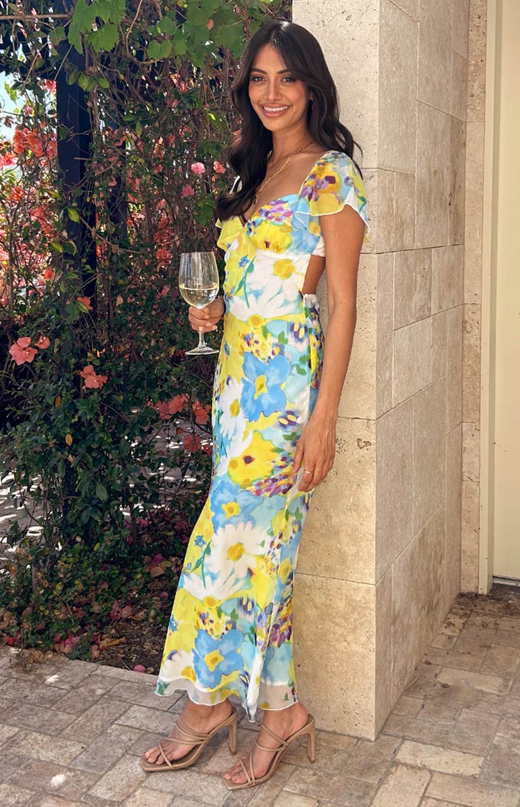 Elegant watercolor floral maxi prom dress with flutter sleeves and tie back.