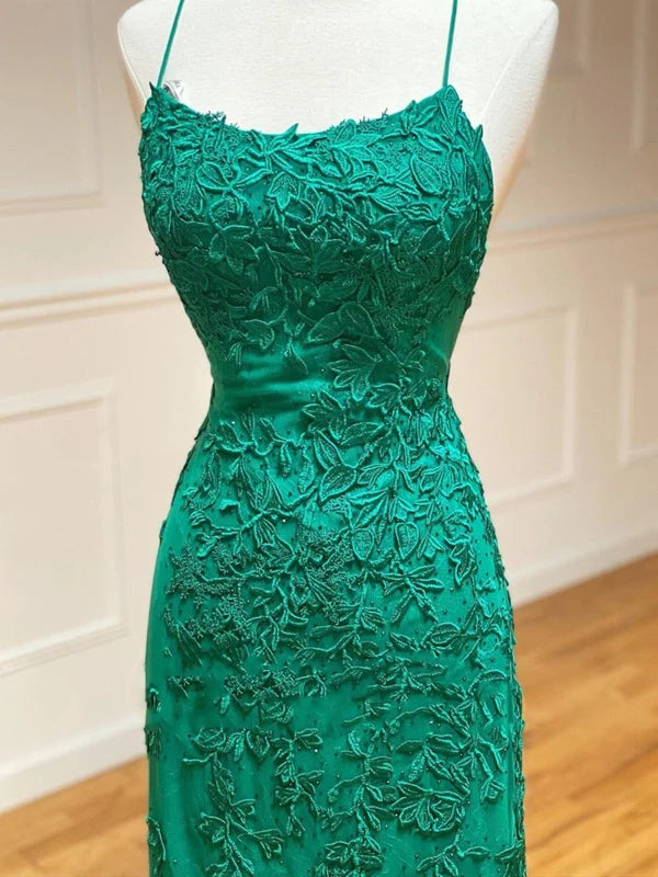 Side profile of a woman wearing a mermaid backless lace long prom dress.