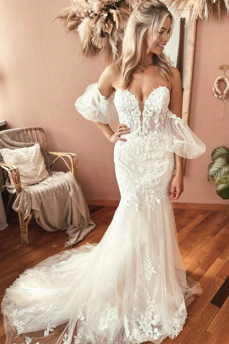 Elegant sweetheart mermaid wedding dress with lace and appliques.