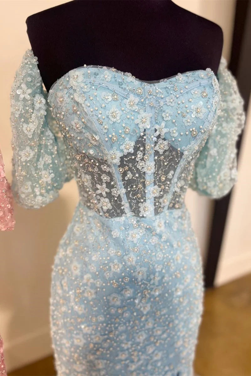 Side view of the long mermaid gown, showcasing the high slit and flowing silhouette.