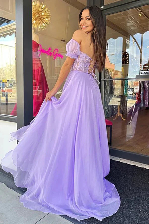 Back view of a long chiffon and lace party dress.