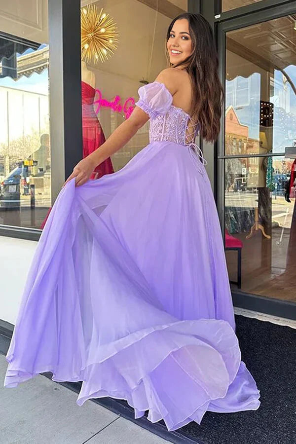 Close-up of lace and chiffon fabric on a long dress.