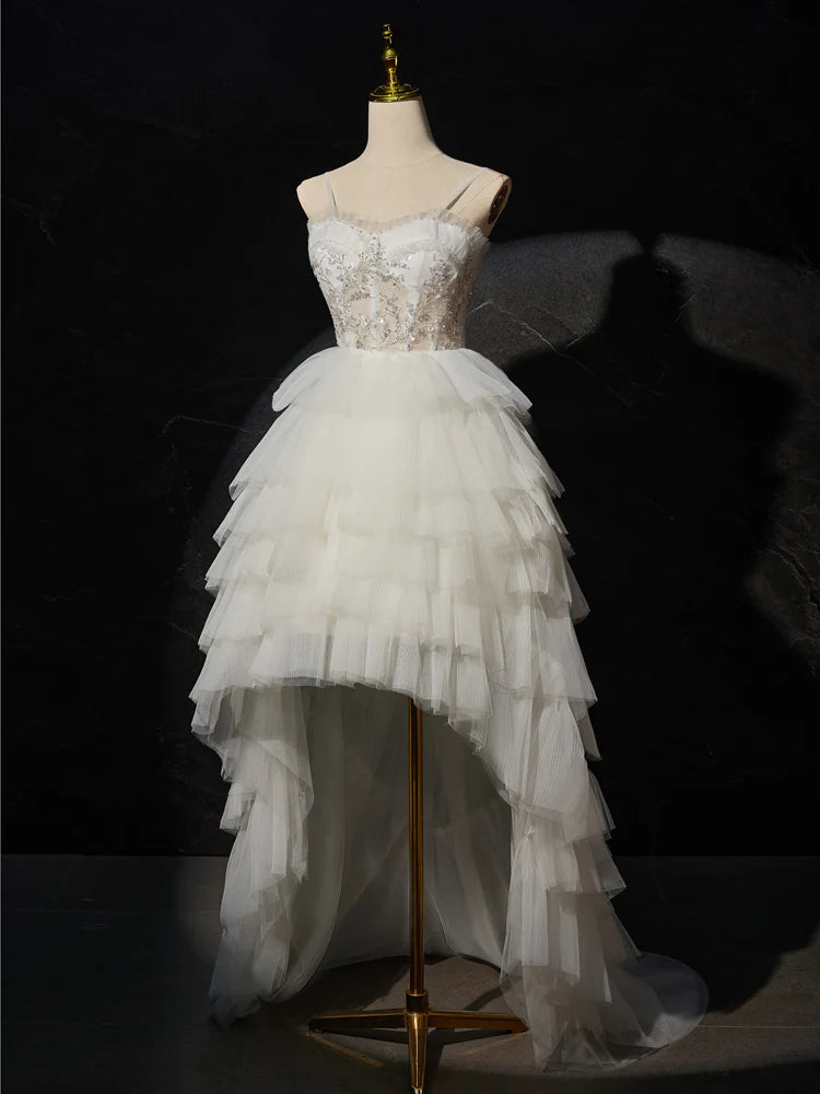 Woman showcasing the flow of the high low prom dress.