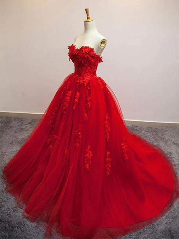Close-up of the intricate lace appliques and sweetheart neckline on the long prom gown.