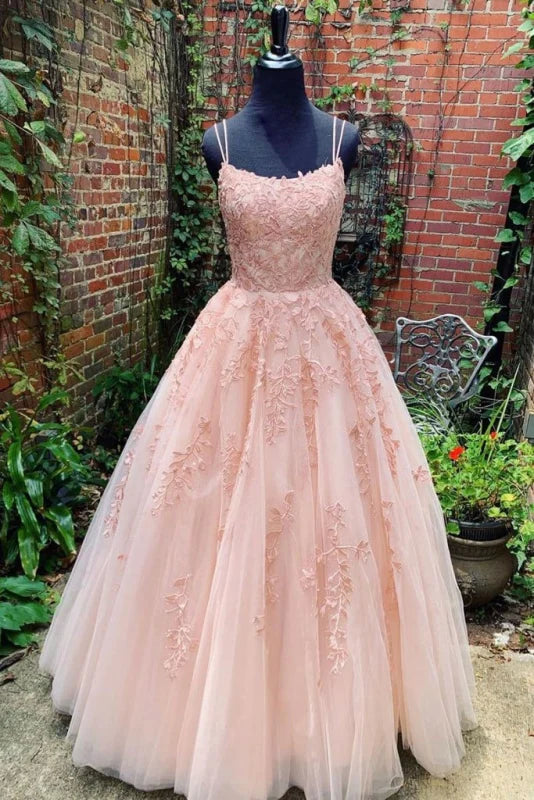 Elegant floor-length prom dress with spaghetti straps, sweetheart neckline, tulle skirt, and lace appliques.